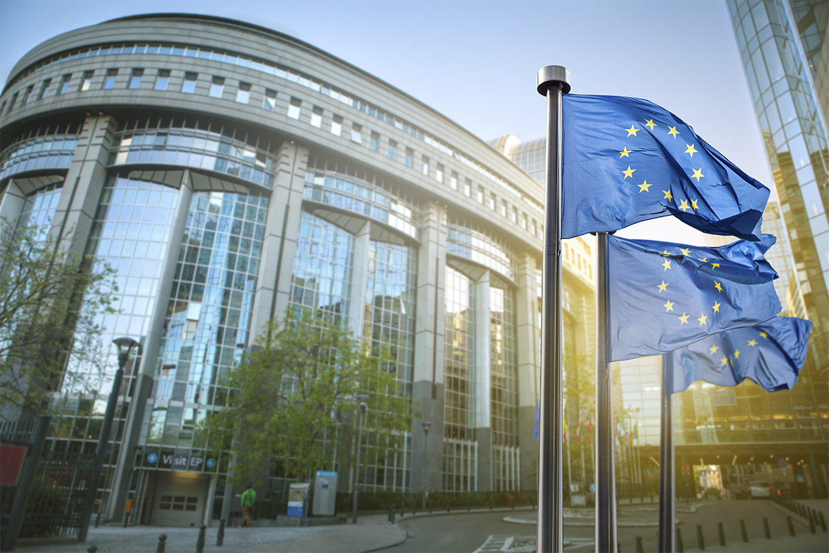 European union flag against parliament in Brussels